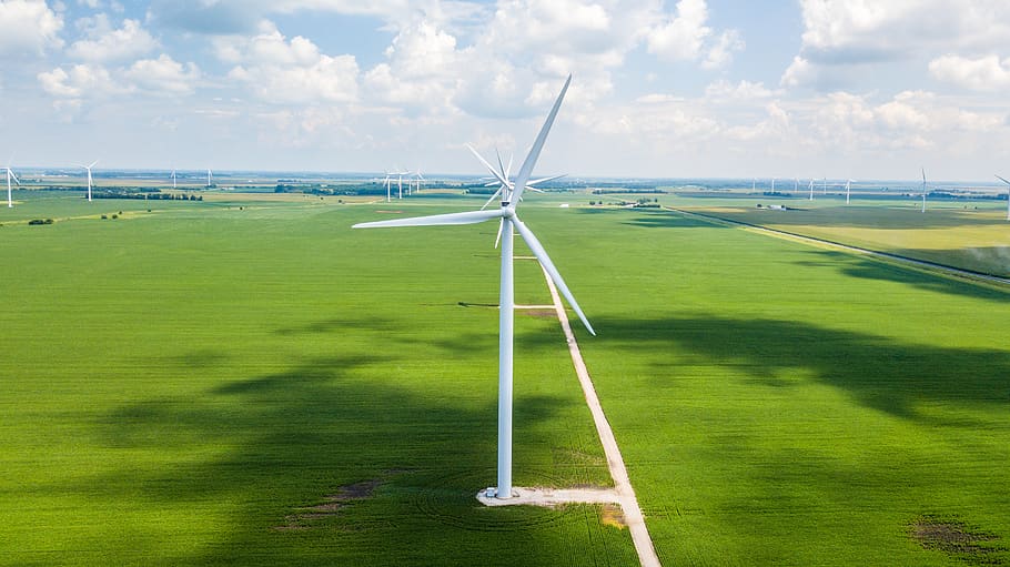 landscape photo of wind turbine surrounded by grass, engine, machine