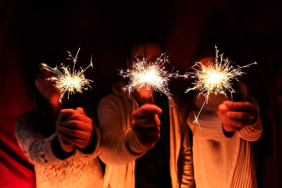sparkles, newyear, red, fireworks, sparkler, burning, human hand HD wallpaper