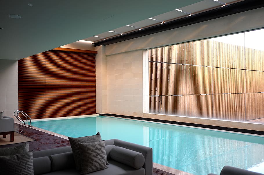 two gray sofas beside pool in room, luxury, indoors, wealth, modern HD wallpaper