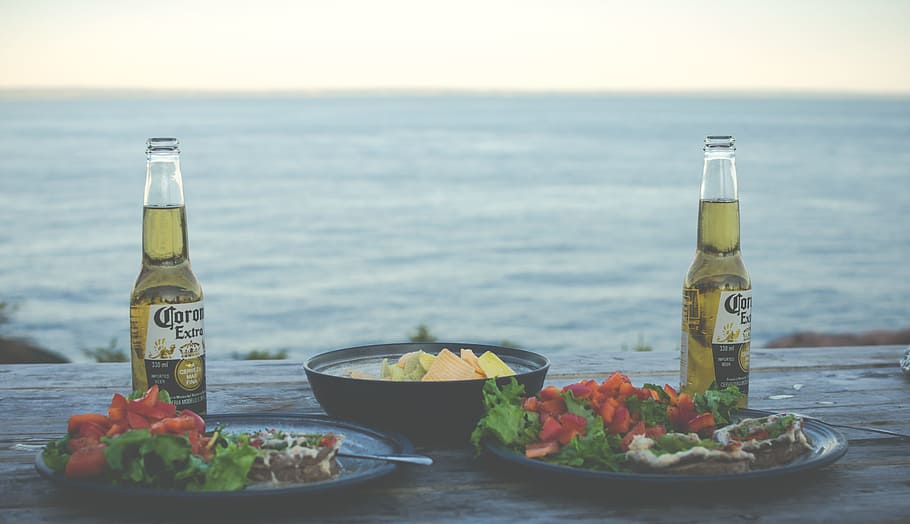 two Corona Extra bottles near cook food, table, eat, outdoors, HD wallpaper
