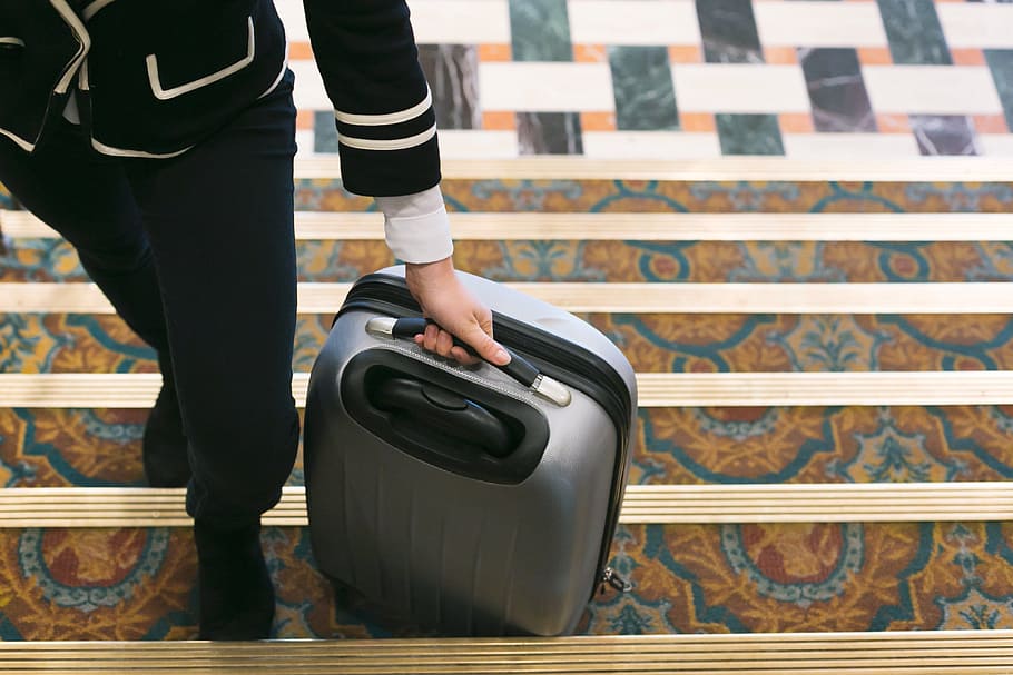 Rolling Suitcase Into Hotel Photo, Women, Business, Travel, Trip