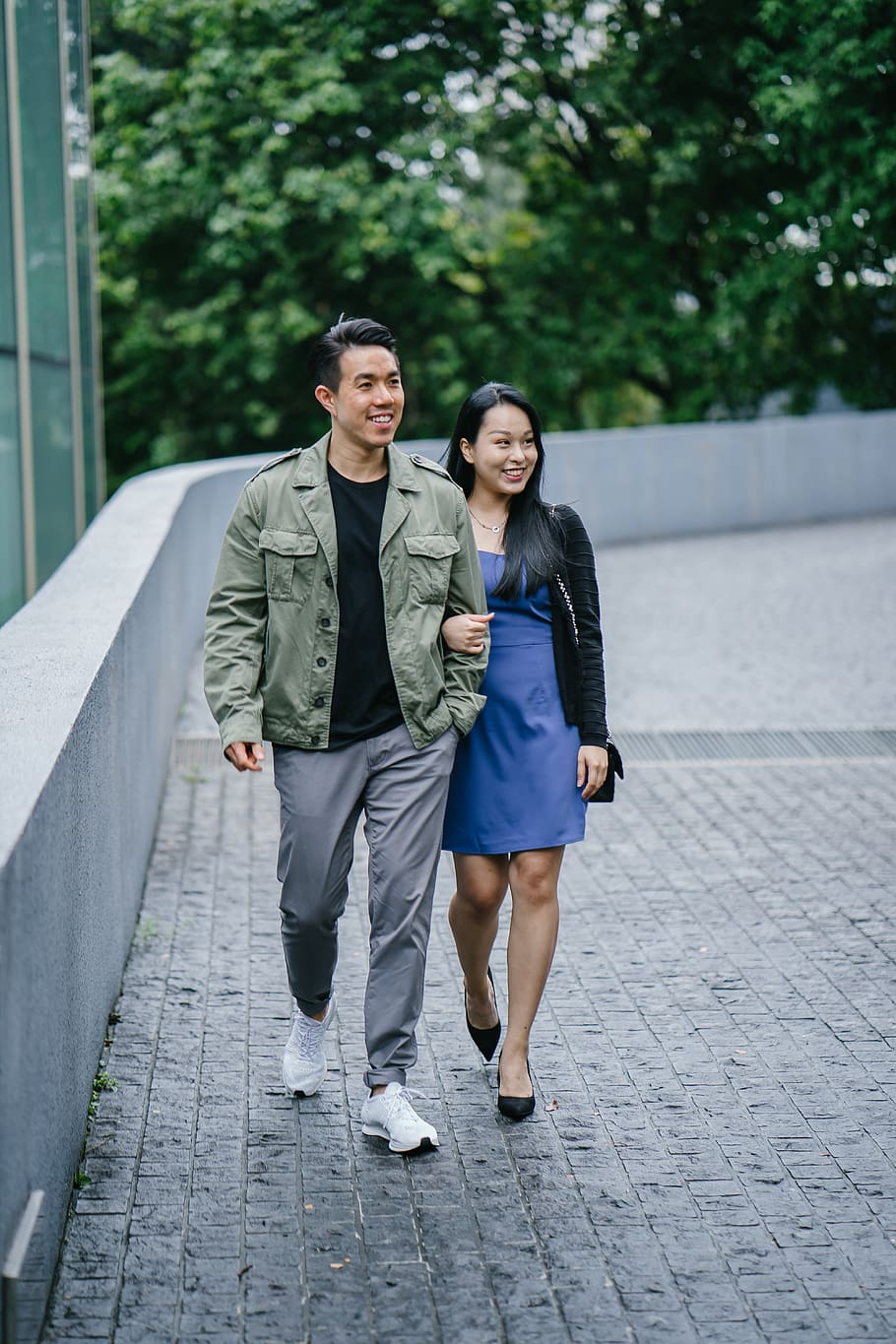 Man and Woman Walking Beside A Building, adults, couple, couple walking