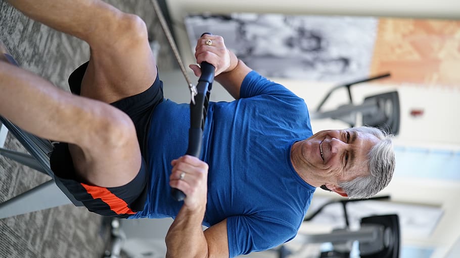 man exercising while smiling, person, human, sport, working out HD wallpaper