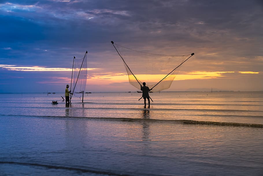 Photo of Two Men Holding Nets in Ocean, beach, clouds, dawn, dusk HD wallpaper