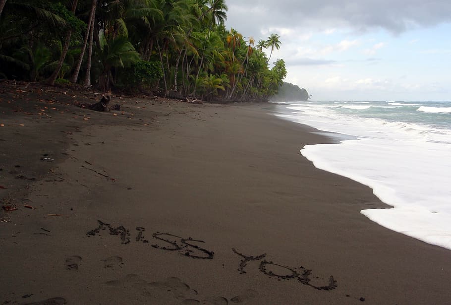 Miss You written in the sand on the beach. Punta Banco, Costa Rica