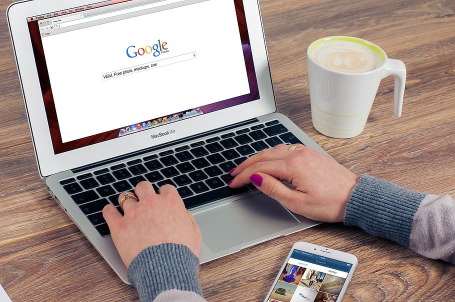 Person Using Macbook Air, apple, coffee, hands, iphone, laptop HD wallpaper