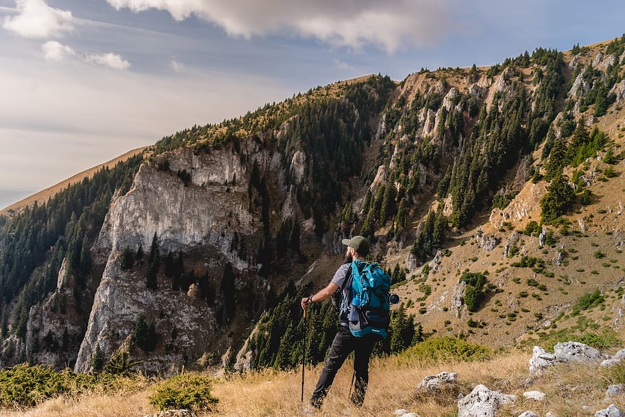 Man Carrying Blue Backpack Holding Black Stick, adventure, beautiful view HD wallpaper