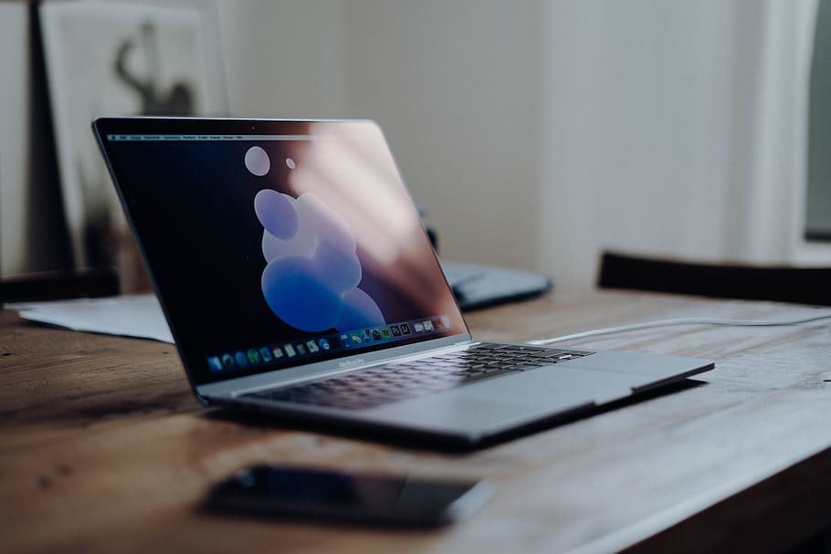 MacBook Pro, computer, laptop, screen, reflection, table, wooden HD wallpaper
