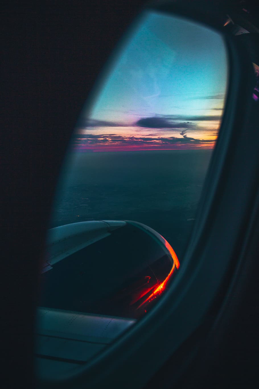 airplane window during golden hour, mirror, light, flare, vehicle