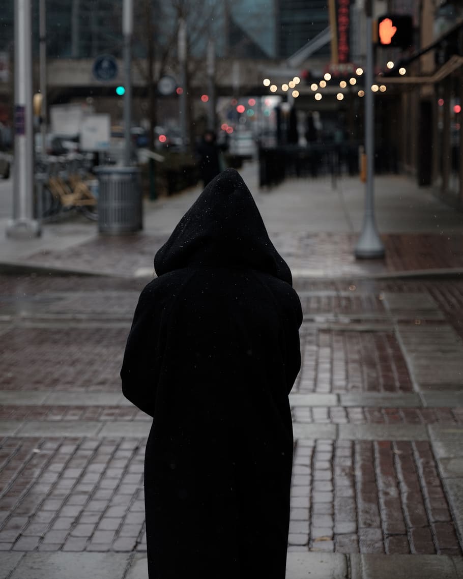 person wearing hooded coat walking towards traffic light, apparel, HD wallpaper
