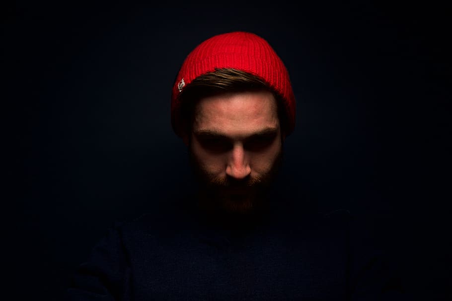 people, man, guy, face, red, beanie, dark, portrait, one person HD wallpaper