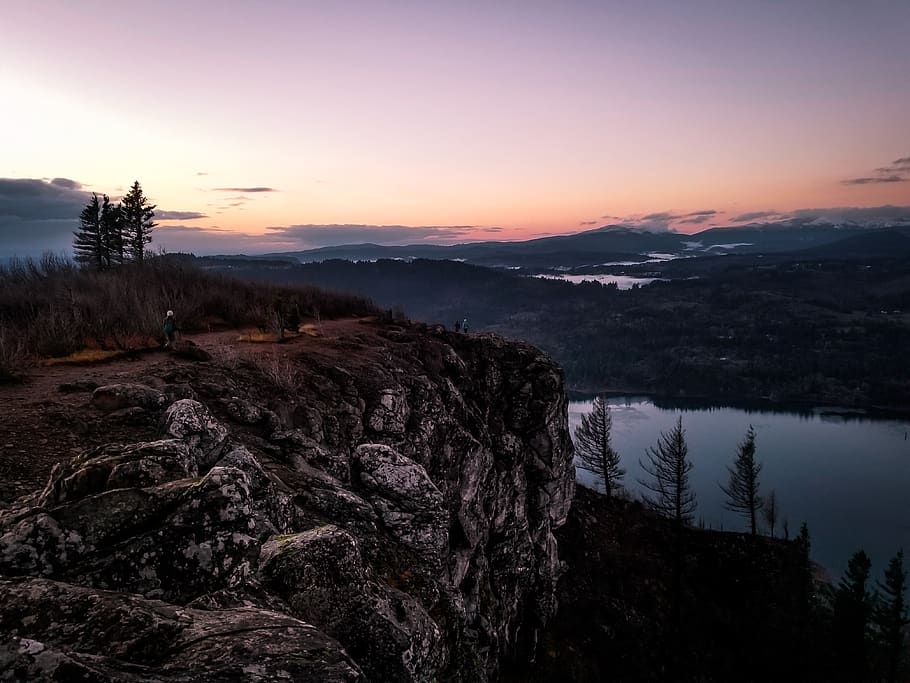 person on hill, nature, outdoors, human, cliff, water, tree, plant HD wallpaper