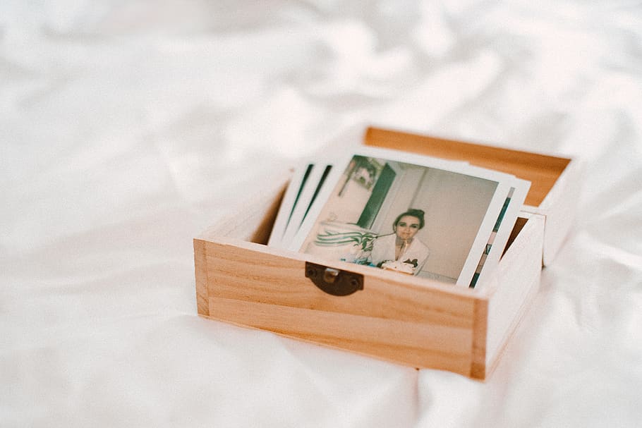 Close-Up Of Pictures On Wooden Box, blur, container, focus, memories HD wallpaper