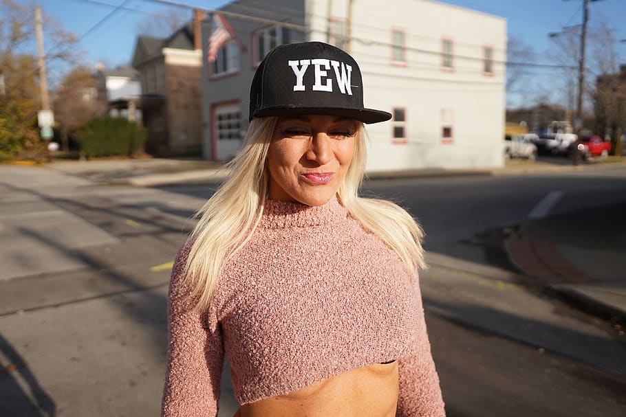 Woman Wearing Cap and Crop Top Standing on Road, beautiful woman