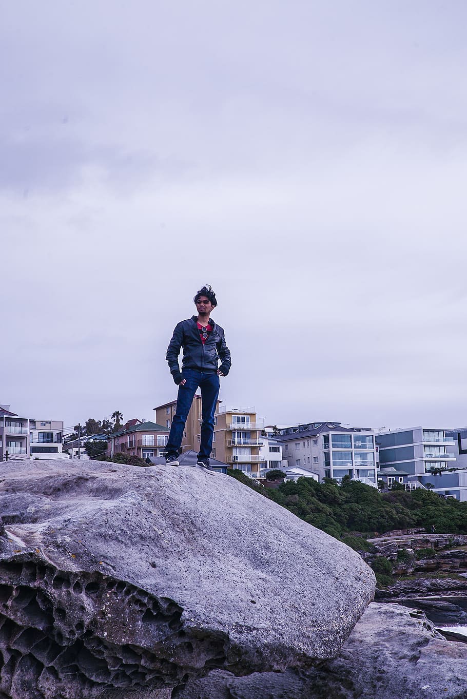 Man Standing on Gray Rock, architecture, boulders, buildings HD wallpaper