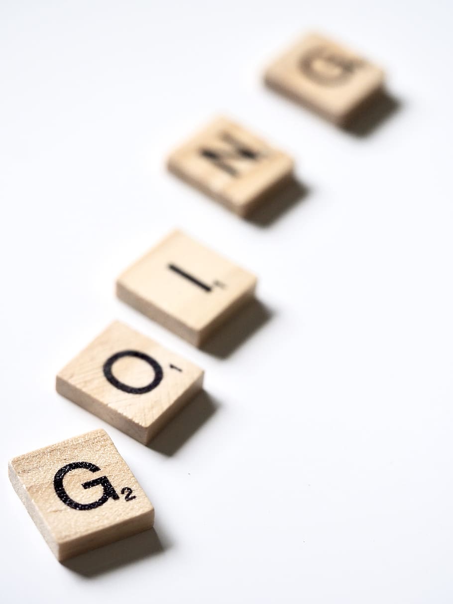 Going scrabble chips, studio shot, white background, close-up HD wallpaper