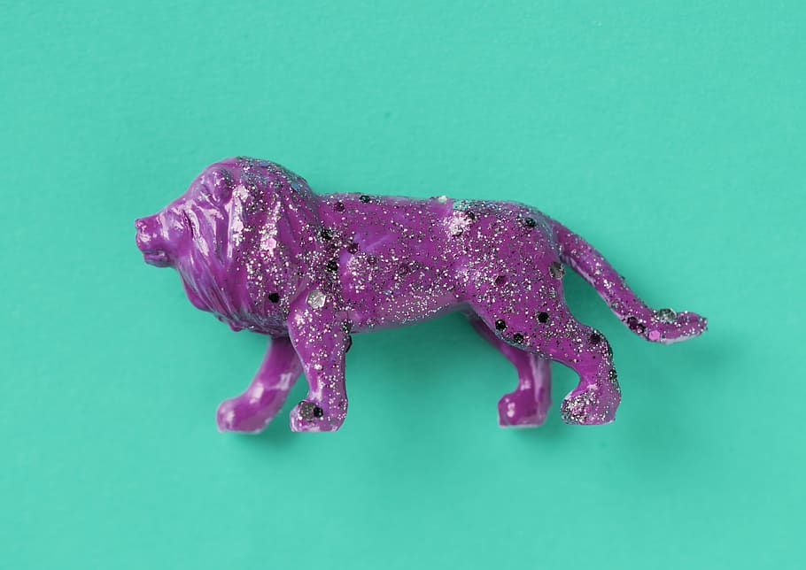 Purple Lion Ceramic Figurine on Green Surface, animal, art, close-up