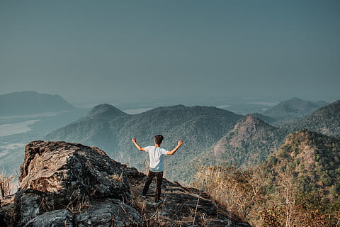 man standing on mountain cliff, person, human, nature, outdoors HD wallpaper