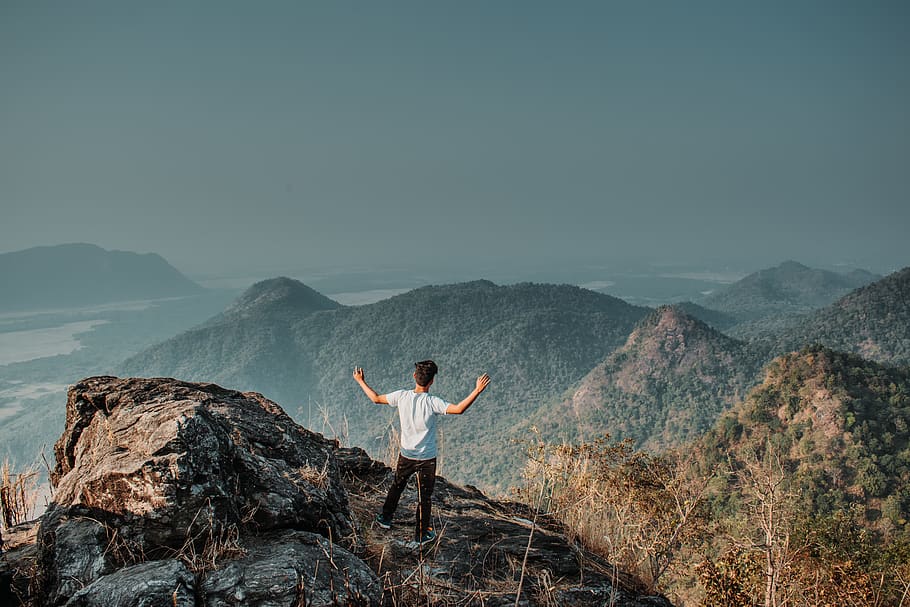 man standing on mountain cliff, person, human, nature, outdoors HD wallpaper