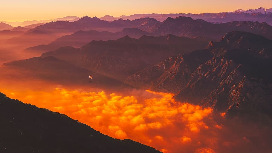 Scenic View of Mountains Against Dramatic Sky at Sunset, adventure HD wallpaper