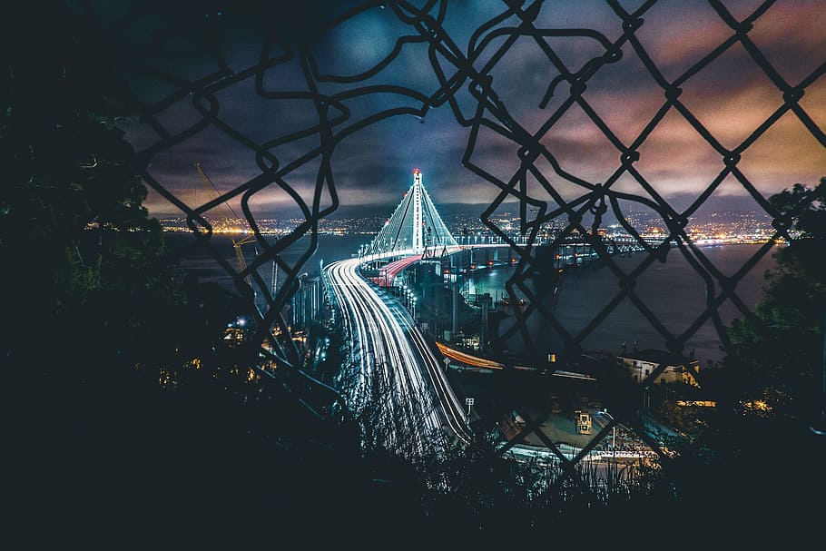 bridge, fence, hole, night, city, traffic, lights, sea, water HD wallpaper
