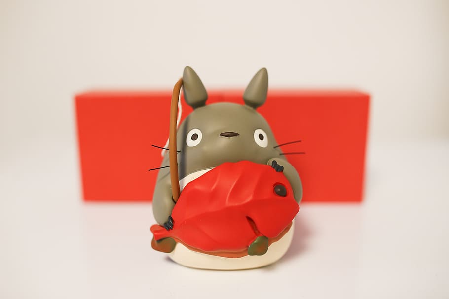 gray cat holding fish toy, figurine, art, sweets, confectionery HD wallpaper