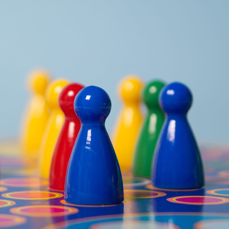 Closeup Photography of Yellow, Red, Green, and Blue Chess Piece HD wallpaper
