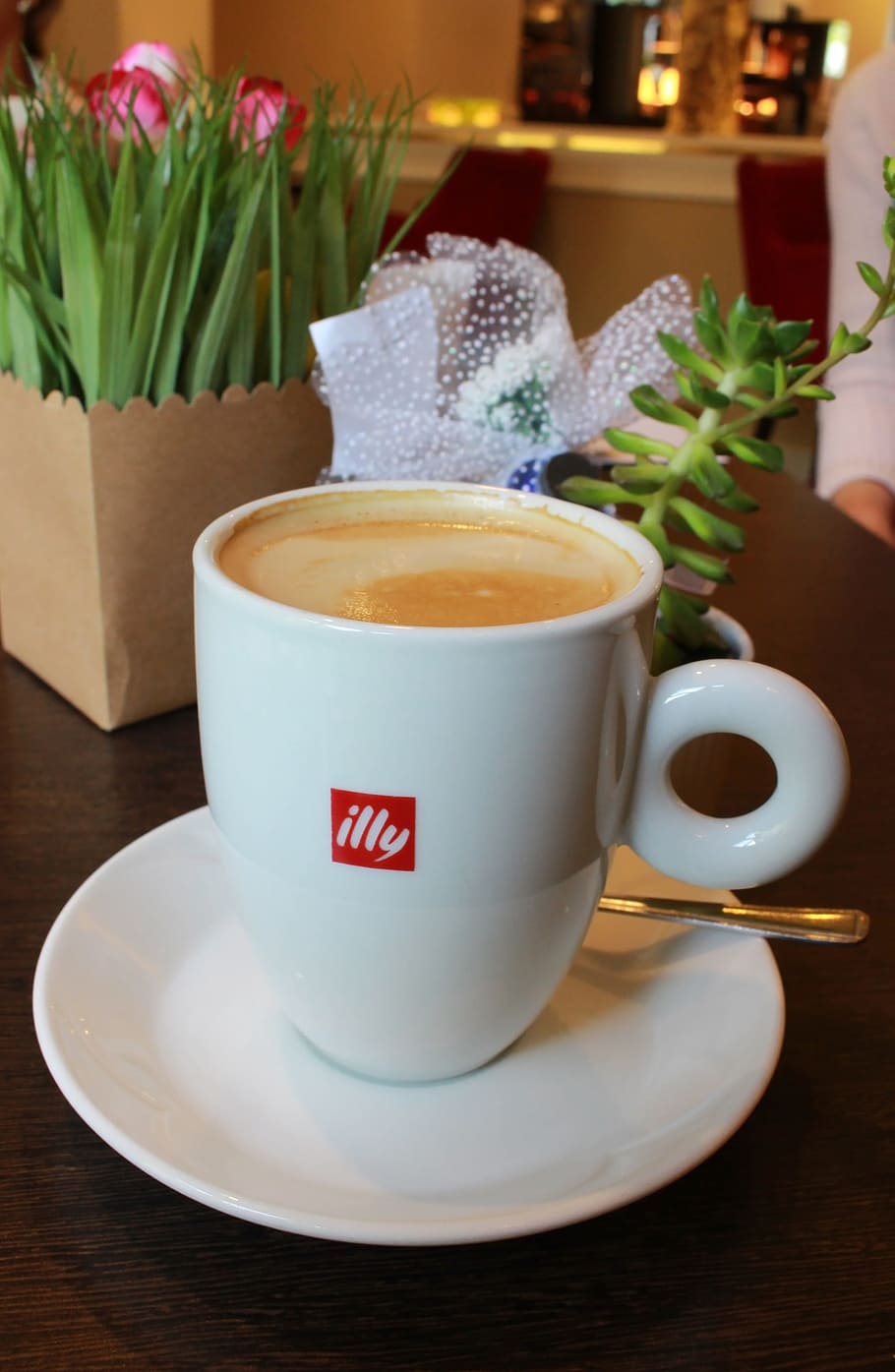 Cup of Illy branded coffee - Illycaffe is an Italian coffee roasting company specializing in espresso - Editorial Use Only