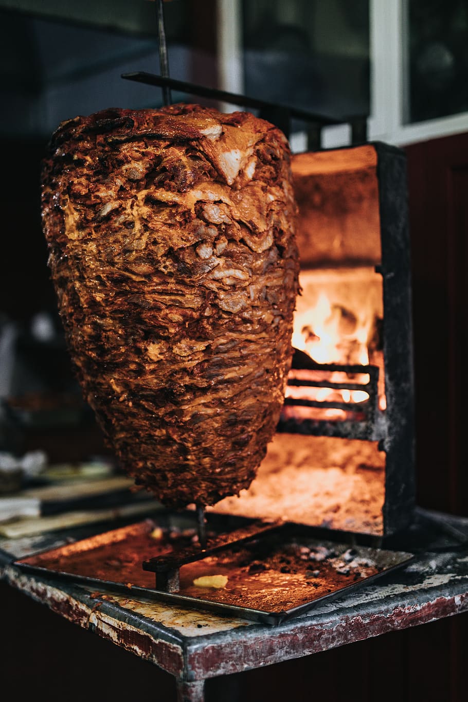 shawarma on a pit, indoors, fireplace, hearth, bread, food, ice cream