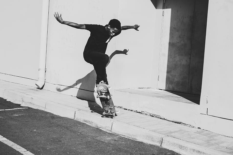grayscale photo of man playing skateboard, person, human, sports