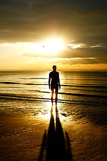 statue, man, crosby, sea, ocean, sun, shadow, portait, silhouette HD wallpaper
