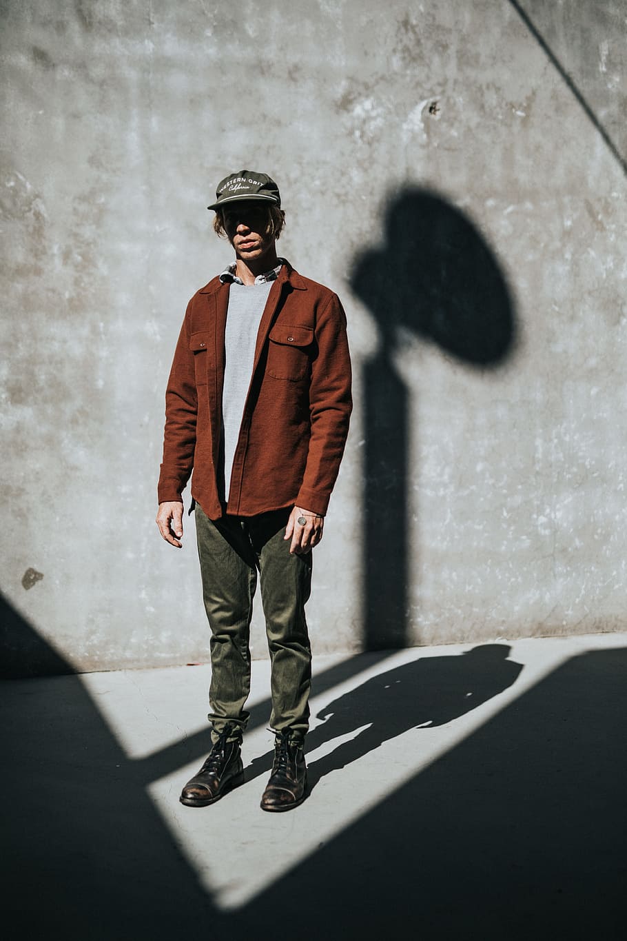 man stands near concrete wall with shadow, model, male, fashion HD wallpaper