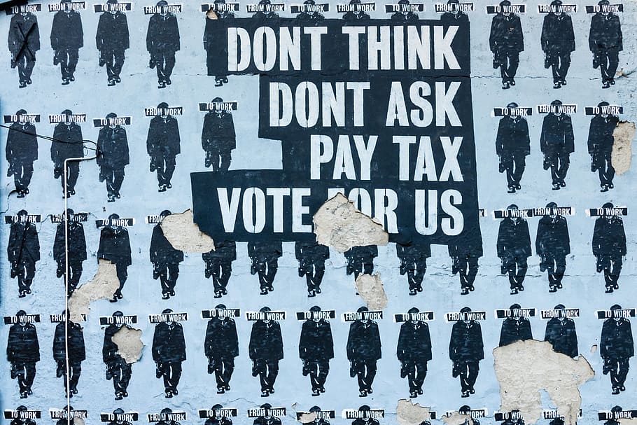don't think do't ask pay tax vote for us text, sign, mural, politicly