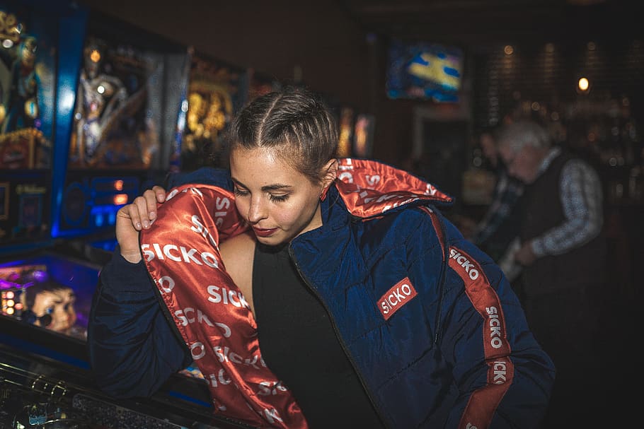 Woman Looking Down While Holding Her Blue and Red Sicko Jacket, HD wallpaper