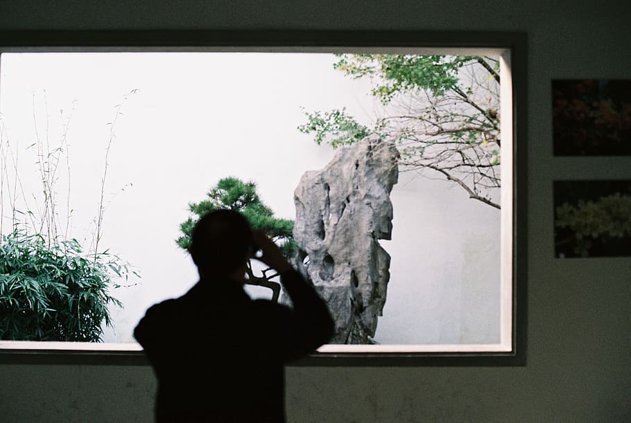 Person Taking Photo of Rock Formation, backlit, exhibition, inside HD wallpaper