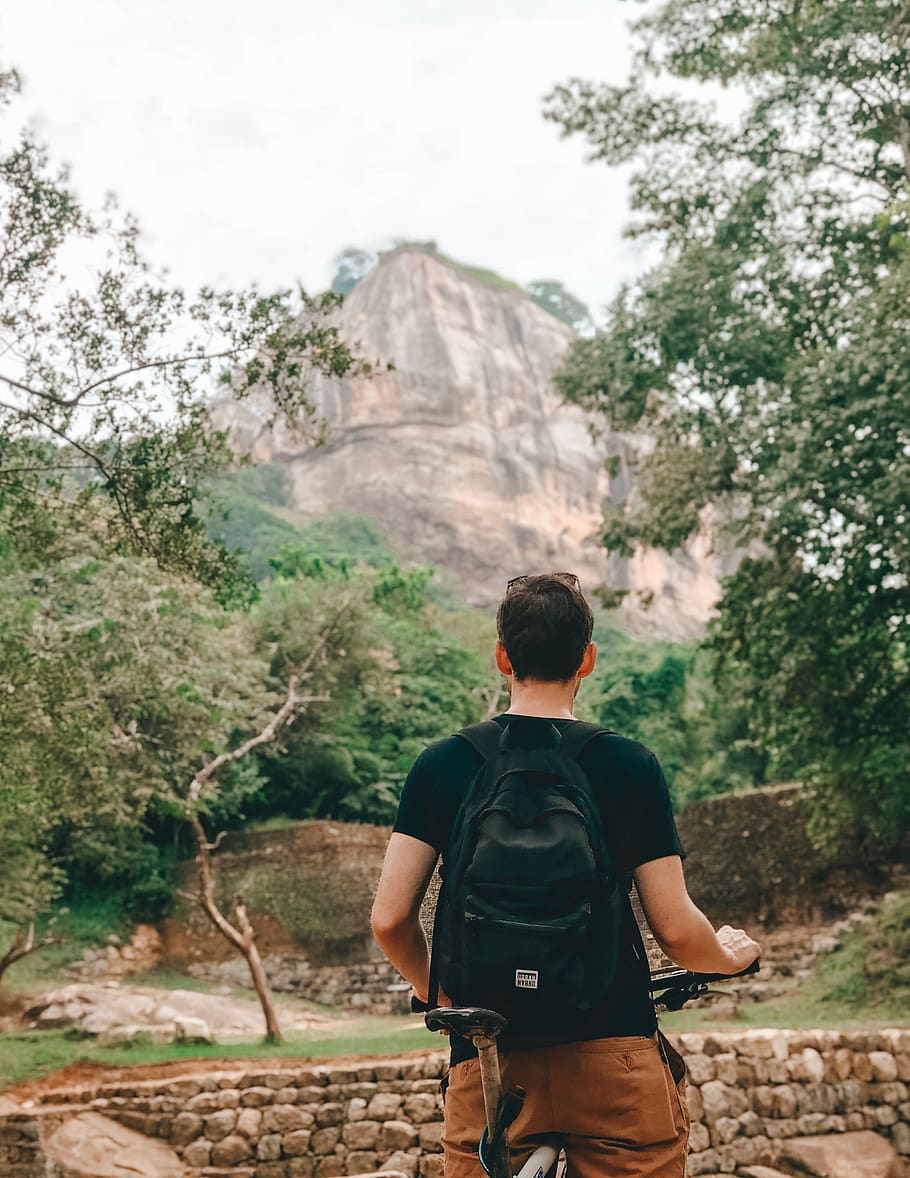 man standing near mountain, human, person, shorts, clothing, apparel HD wallpaper