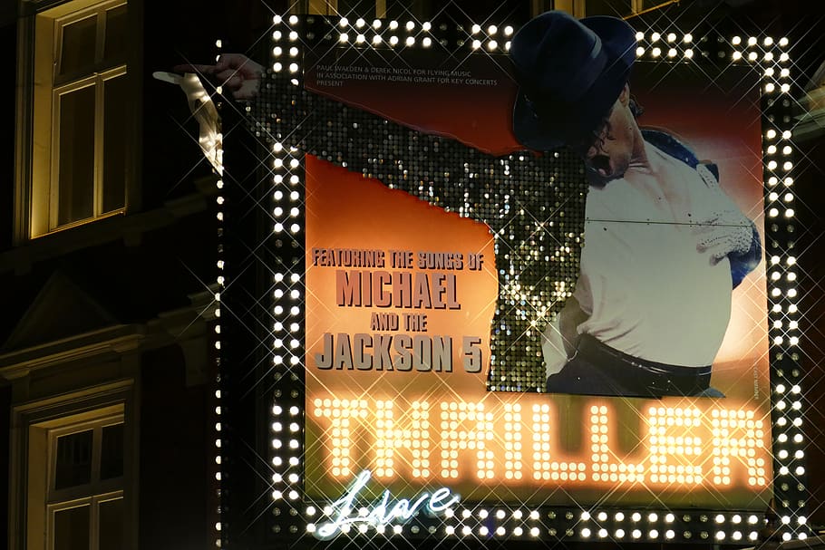 Michael Jackson 5 billboard during nighttime, text, communication