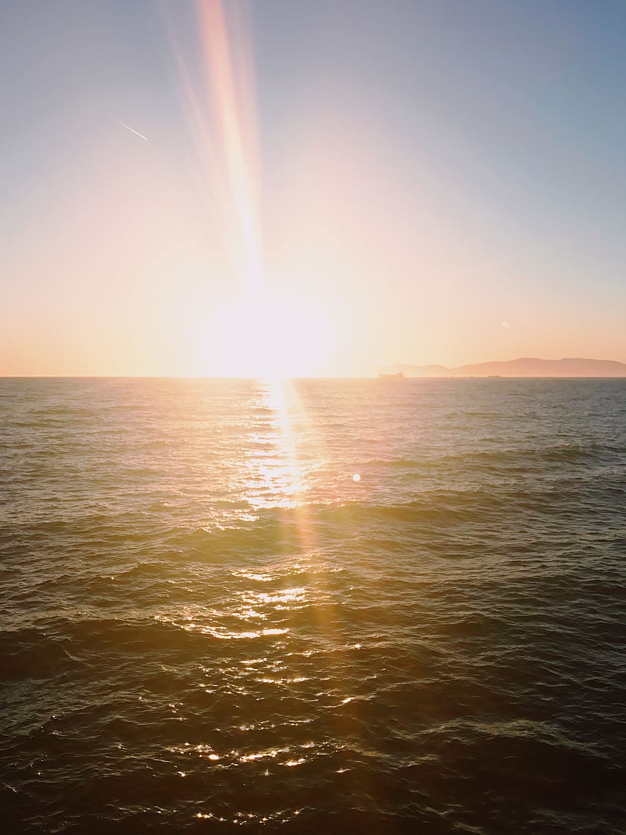 sun, rays, sunset, water, beach, ocean, yellow, orange, blue HD wallpaper