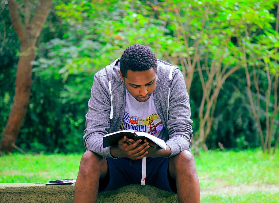 man sitting on concrete bench reading book, leisure activity HD wallpaper
