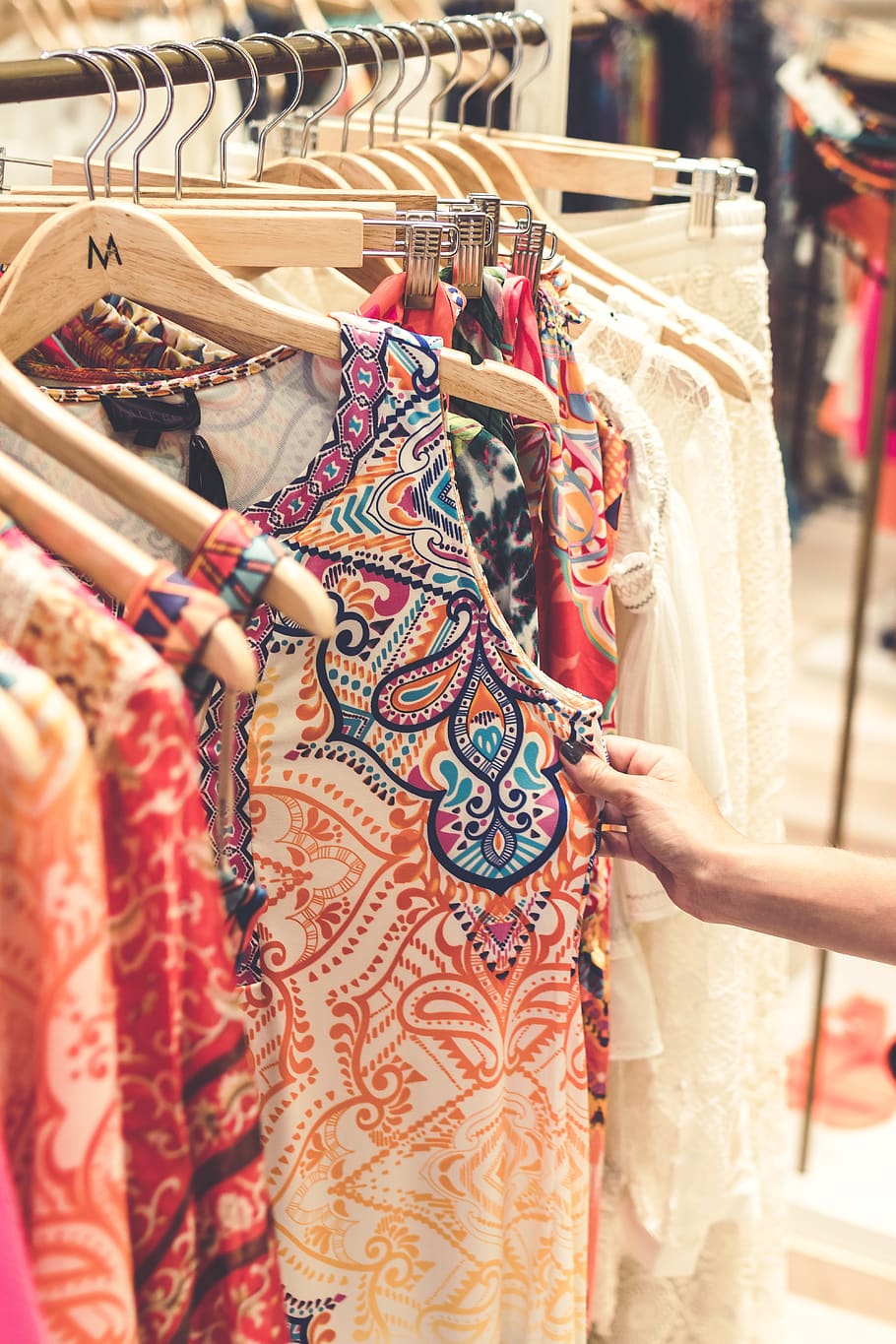 Shallow Focus Photography of Assorted-color Clothes Hanged on Clothes Rack HD wallpaper