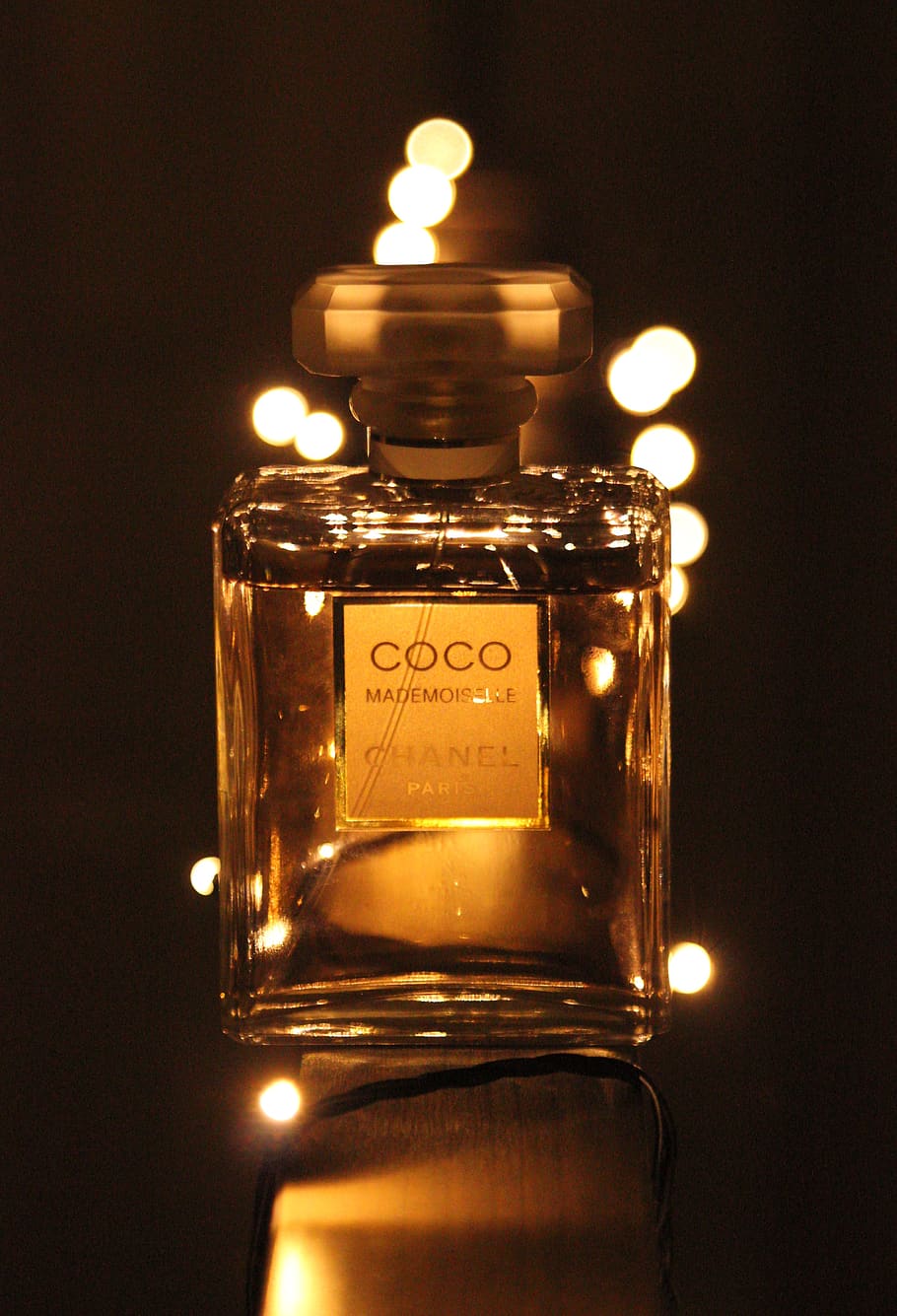 bokeh, perfume bottle, illuminated, indoors, glass - material