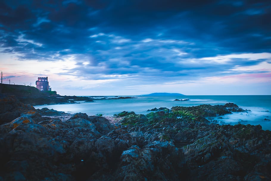 Lighthouse on Cliff Near Sea, bay, beach, dawn, evening, landscape HD wallpaper