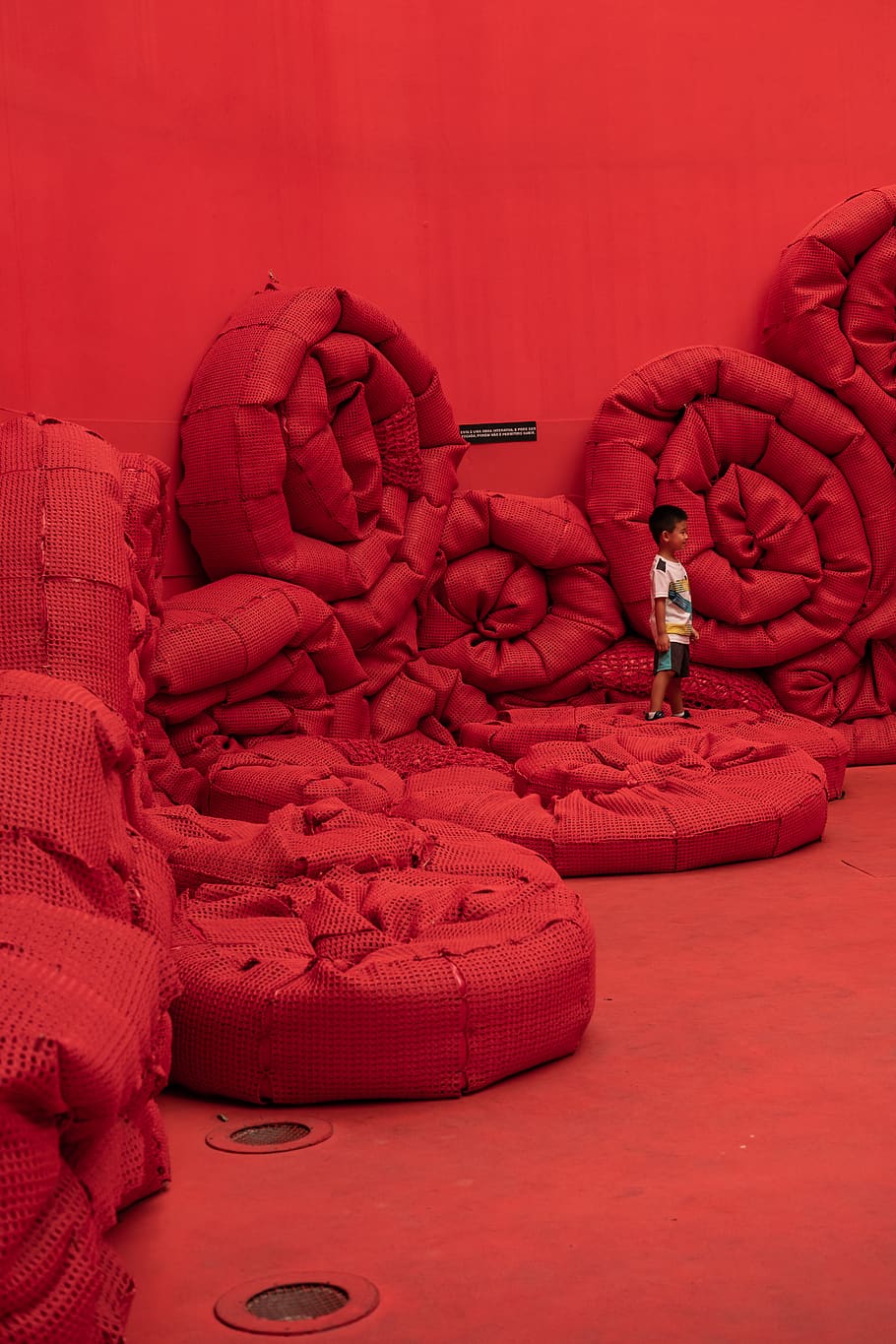 boy standing on round red pads, one person, full length, adult HD wallpaper