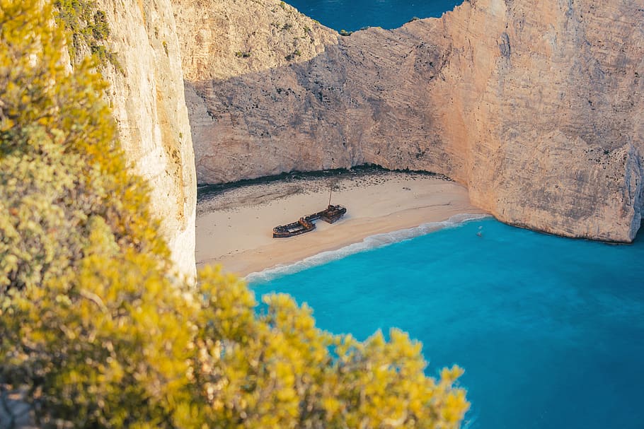 Brown Wooden Boat on Shore, beach, beautiful, blue, cliff, clouds HD wallpaper