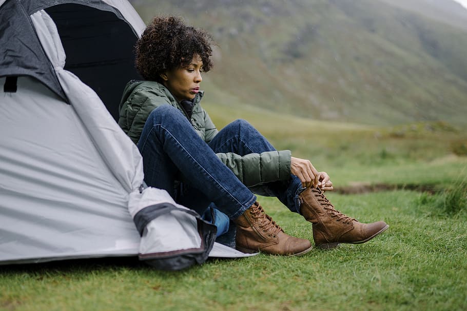 Woman Sitting on Gray Tent Tying shoe lace, beautiful, boots, HD wallpaper