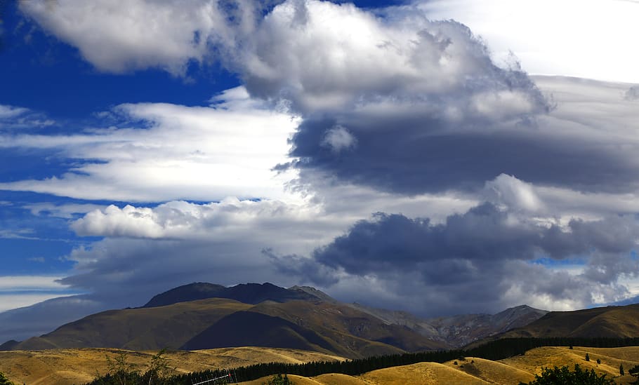 landscape, moody, mountain, cloudforms, tawny hills, storm brewing HD wallpaper