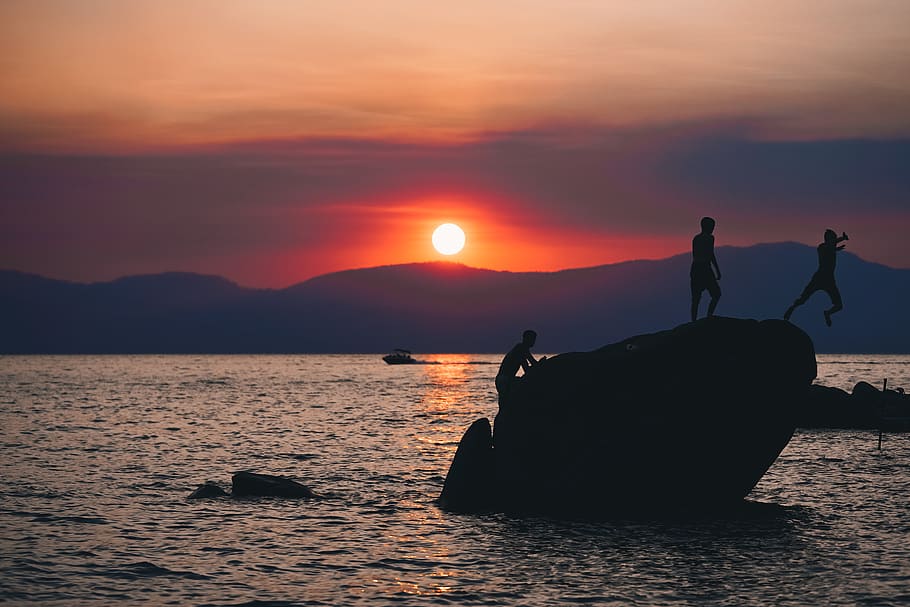sunset, sky, water, beauty in nature, real people, scenics - nature HD wallpaper