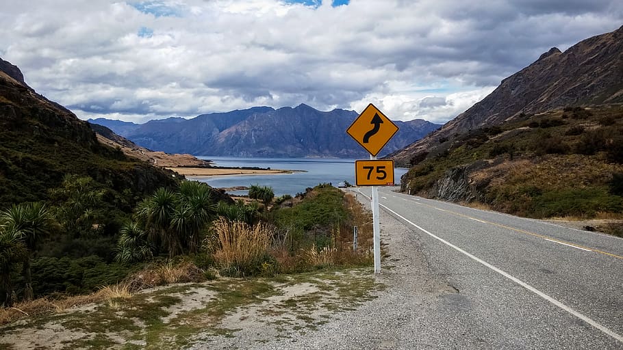 Winding Road Signage, clouds, cloudy, daylight, grass, landscape HD wallpaper