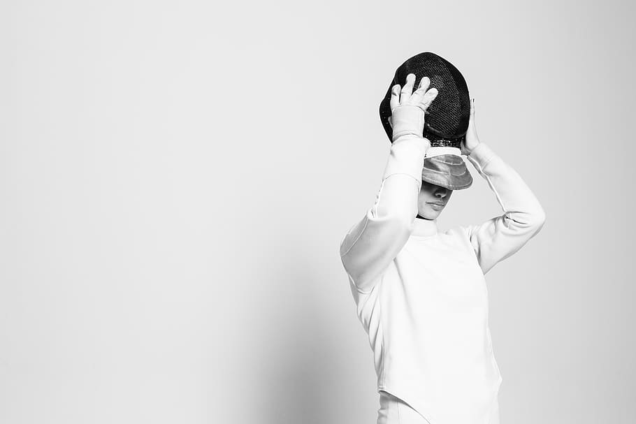 person holding black cap, studio shot, one person, standing, white background HD wallpaper