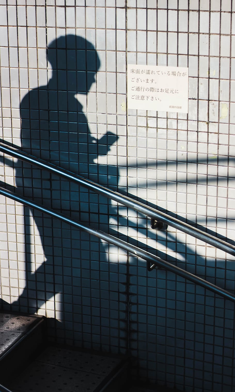 human shadow beside gray wall, tile, person, walking, phone, using phone HD wallpaper